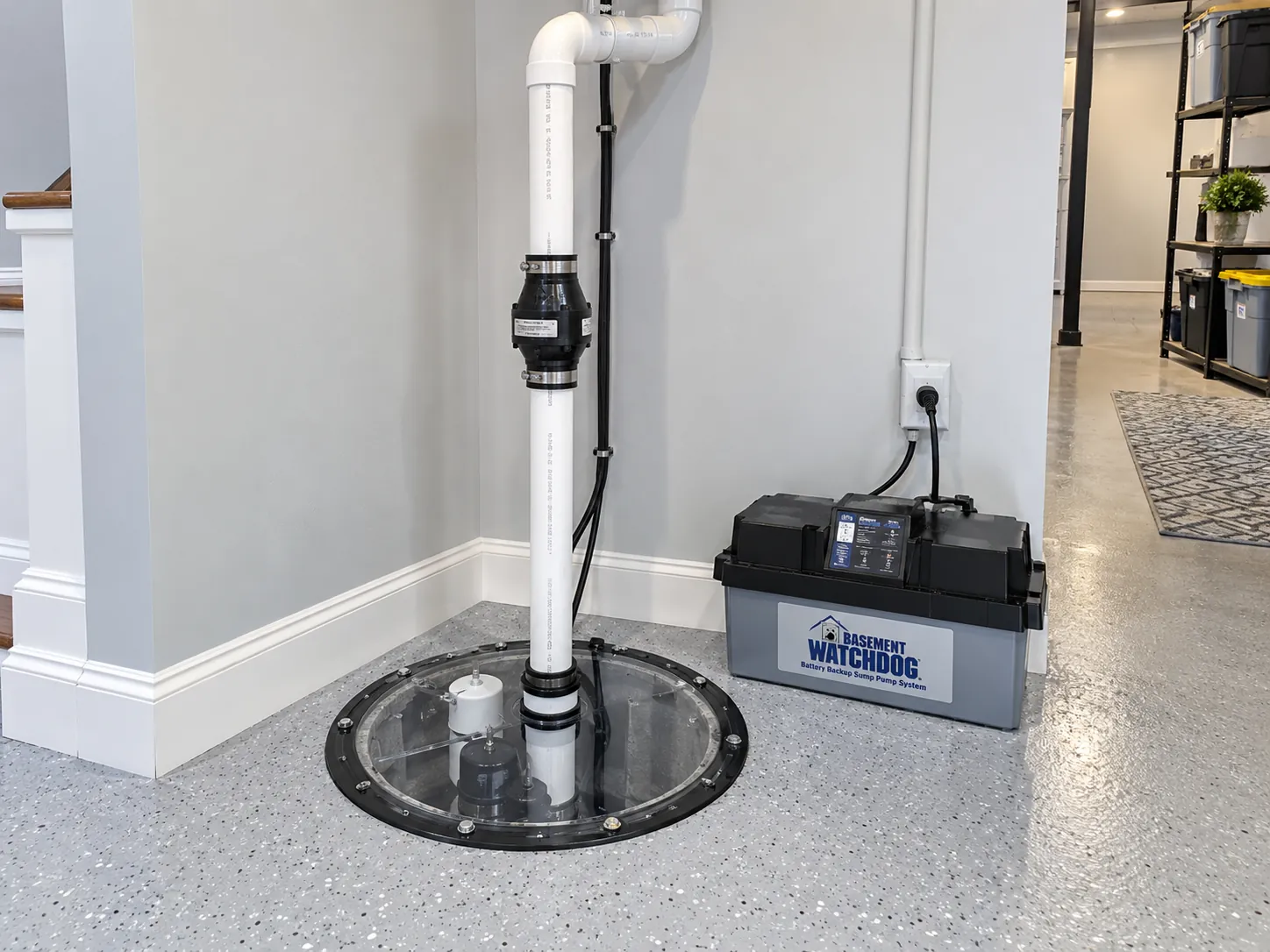 New sump pump in a sealed basin with PVC discharge pipe, check valve, and battery backup in a Maryland basement, installed by SiteDoctorMD